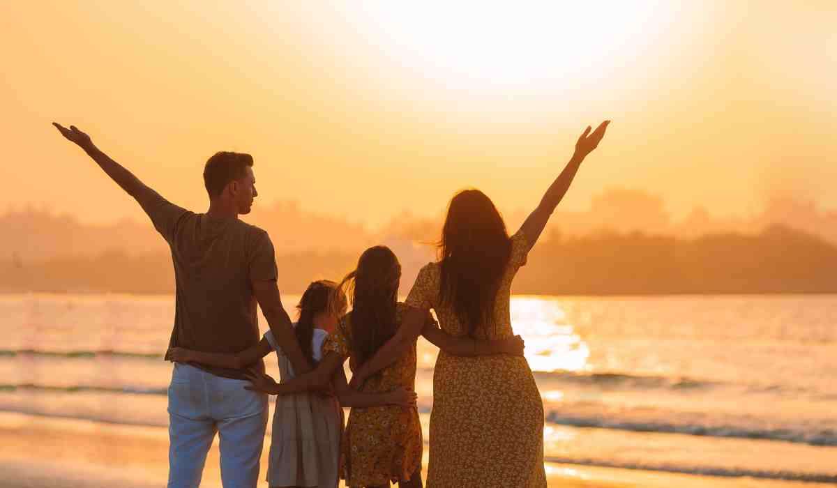 Happy family on vacation exploring a beach