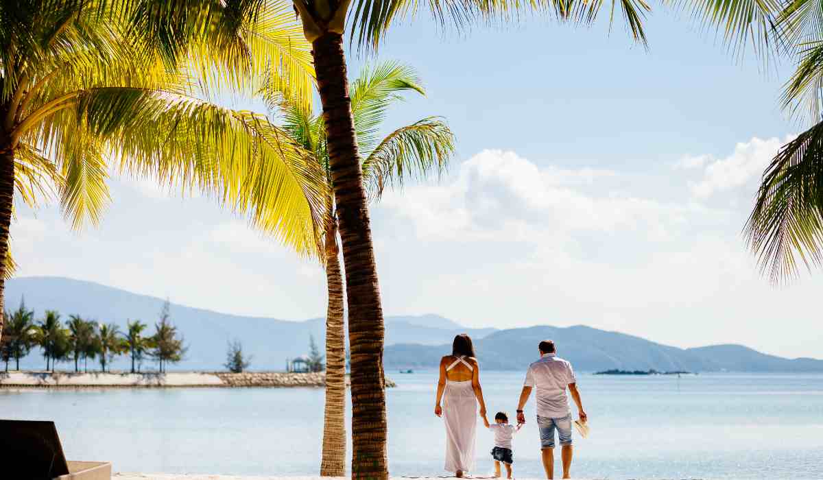 Happy family on vacation exploring a beach