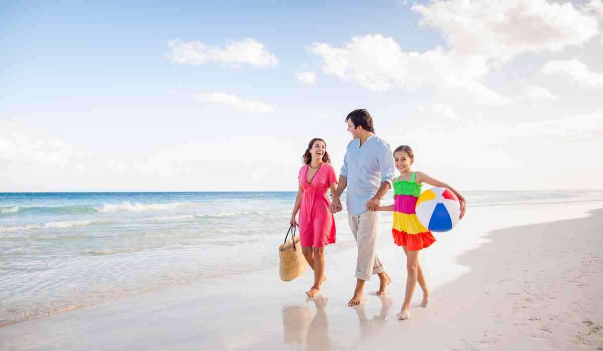 Happy family on vacation exploring a beach